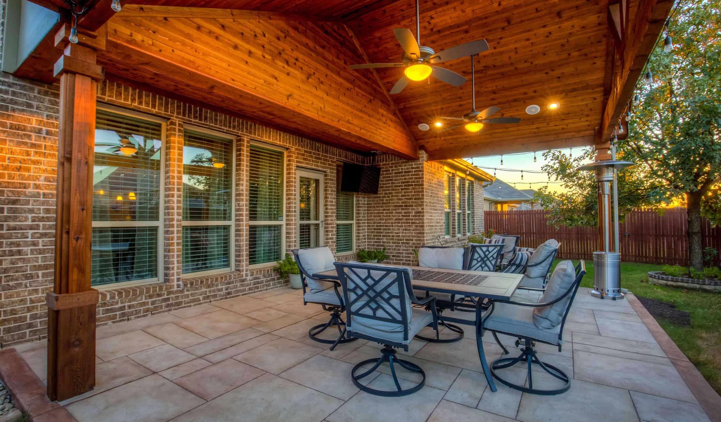Open seating area underneath a cedar patio cover